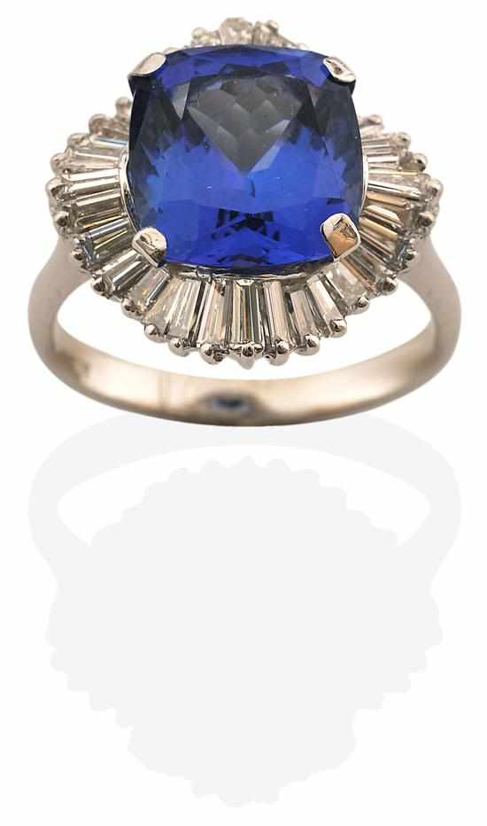 Appraisal: A TANZANITE AND DIAMOND CLUSTER RING Centrally set with a