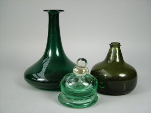 Appraisal: A green glass ships decanter th century cm high together