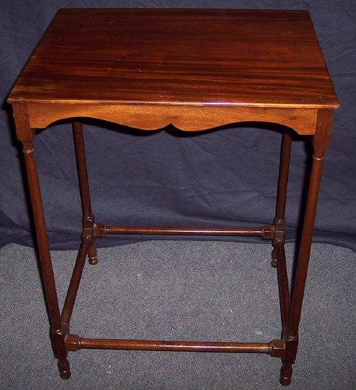 Appraisal: A mahogany side table the rectangular top on slender turned