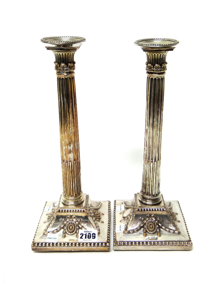 Appraisal: A pair of plated on copper table candlesticks each in