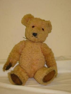 Appraisal: A Chiltern teddy bear covered in curly pink plush with