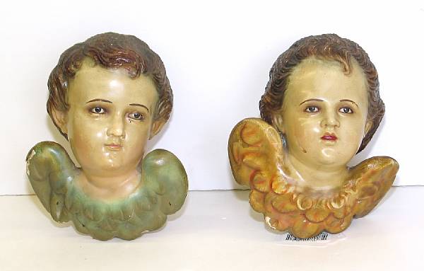 Appraisal: A pair of Italian polychrome wood amorini th century Each