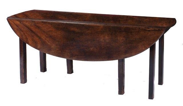 Appraisal: A GEORGE III MAHOGANY WAKE TABLE having two drop leaves