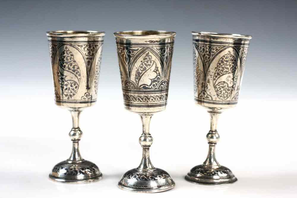 Appraisal: PERSIAN NIELLO CORDIALS - Three Persian Silver Niello Cordials or