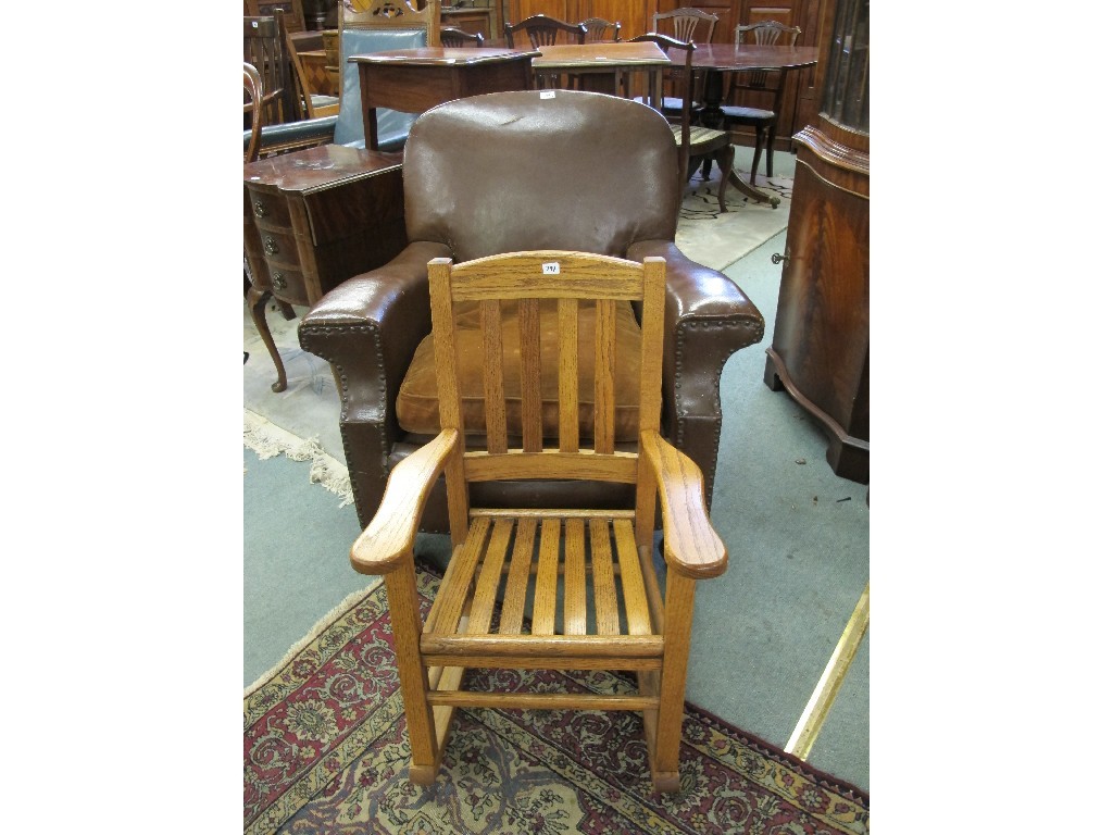 Appraisal: Leather studded armchair and a child's rocking chair