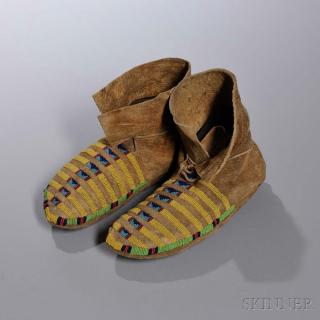 Appraisal: Blackfeet Beaded Hide Moccasins c thick buffalo hide beaded with