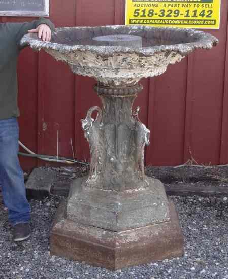 Appraisal: th c cast iron fountain with stylized goose heads one