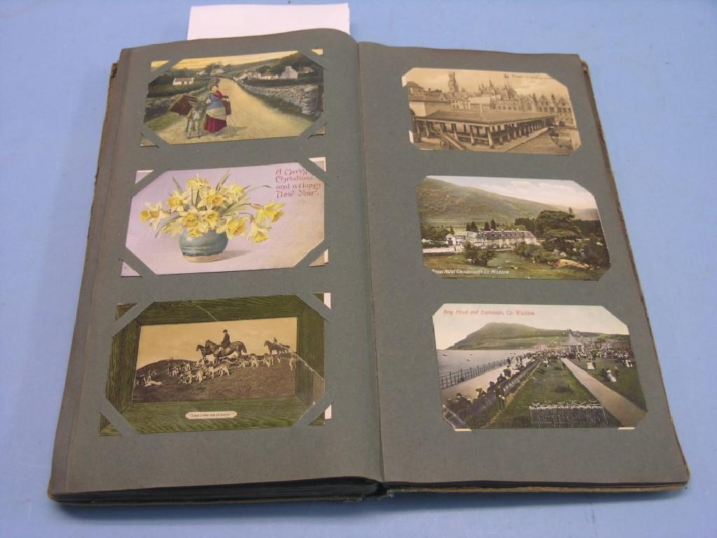 Appraisal: A collection of postcards postcards contained within album