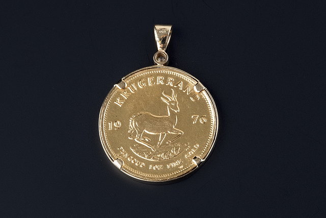 Appraisal: A diamond set krugerrand pendant the full krugerrand coin dated