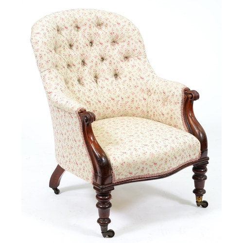 Appraisal: A Victorian mahogany armchair in buttoned upholstery and brass castors