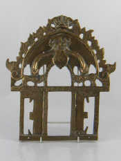 Appraisal: An Indian cast brass shrine surround the rectangular opening with