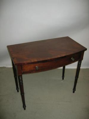 Appraisal: A MAHOGANY SIDE TABLE of bowed form with stringing banded