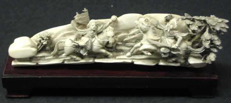 Appraisal: CHINESE IVORY EQUESTRIAN GROUP Deeply carved tusk section revealing two