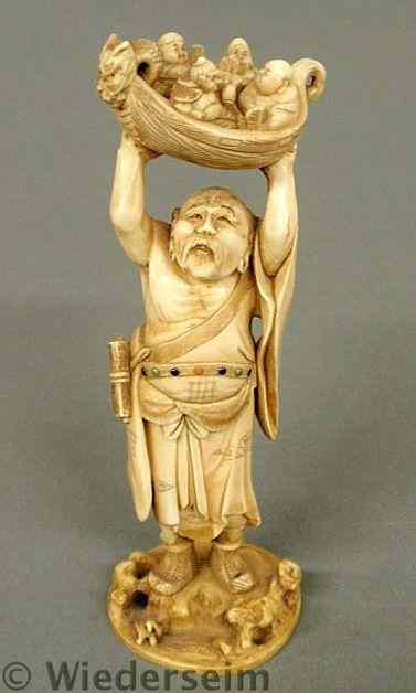 Appraisal: Finely carved Asian ivory figure of a nobleman holding a