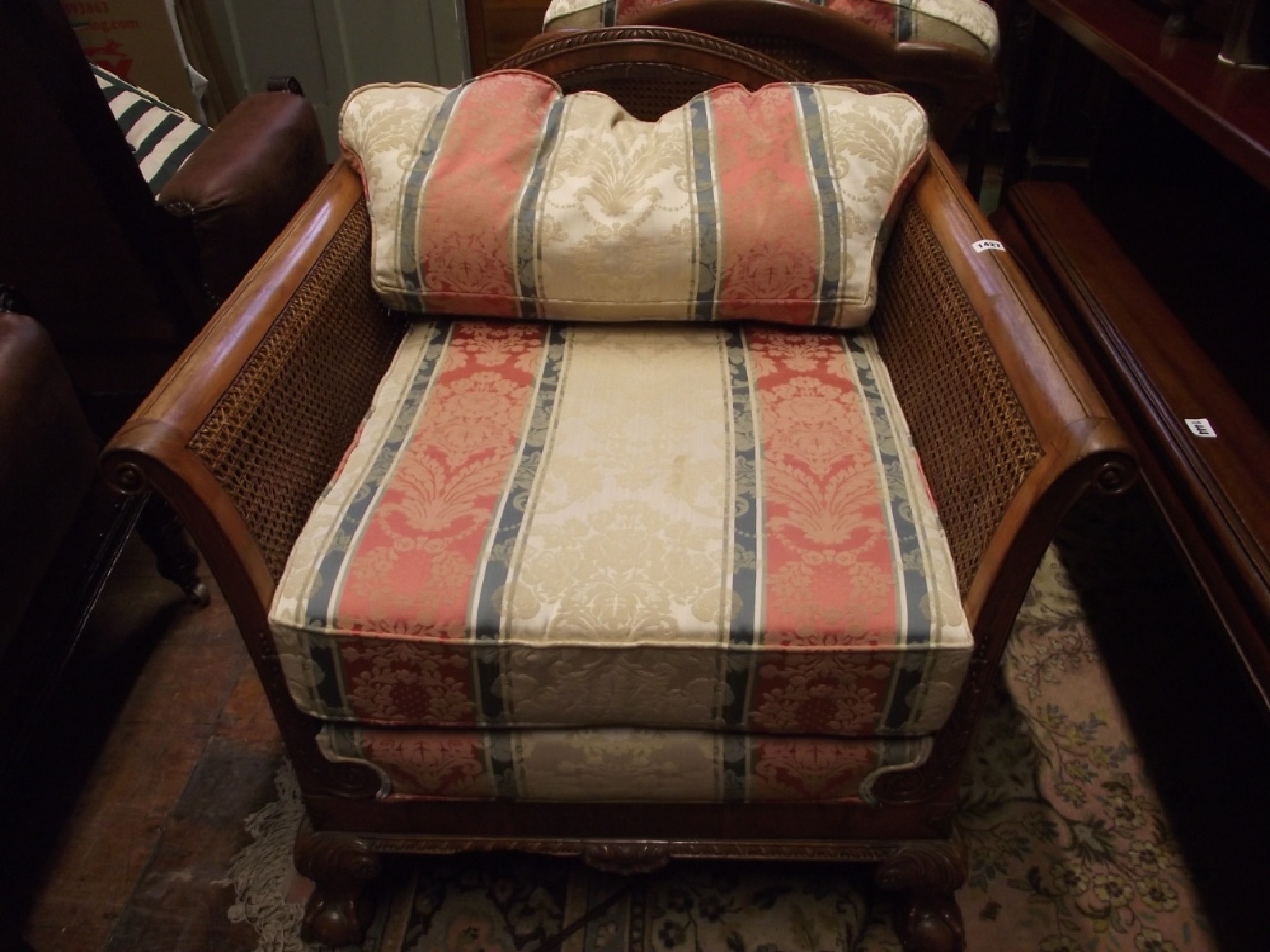 Appraisal: An Edwardian style three piece Bergere suite with three seat