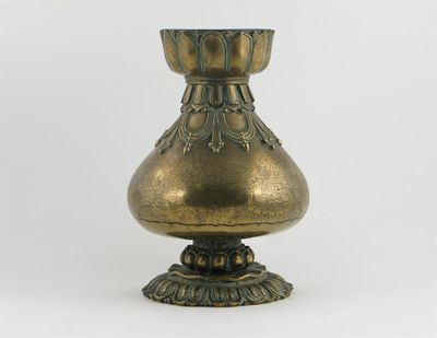 Appraisal: An Indian brass pear-shaped vase the foot and neck cast