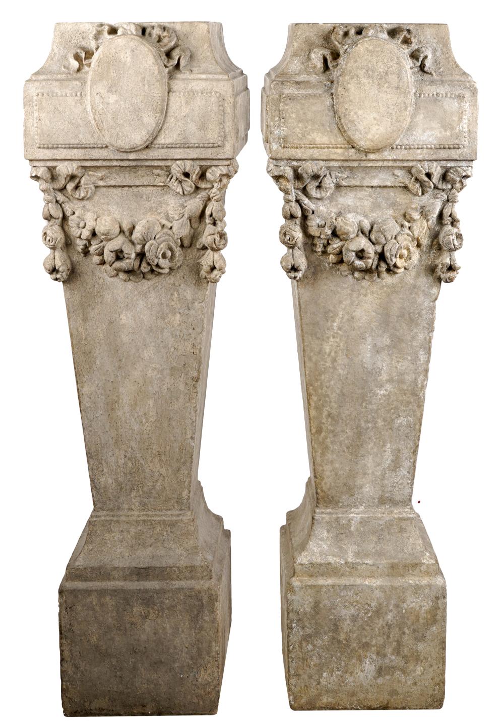 Appraisal: PAIR OF DENNIS LEEN NEOCLASSICAL-STYLE PEDESTALScast stone each with floral