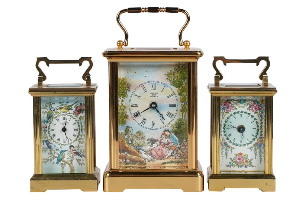 Appraisal: THREE ENAMEL GILT METAL CARRIAGE CLOCKScomprising two Halcyon Days each