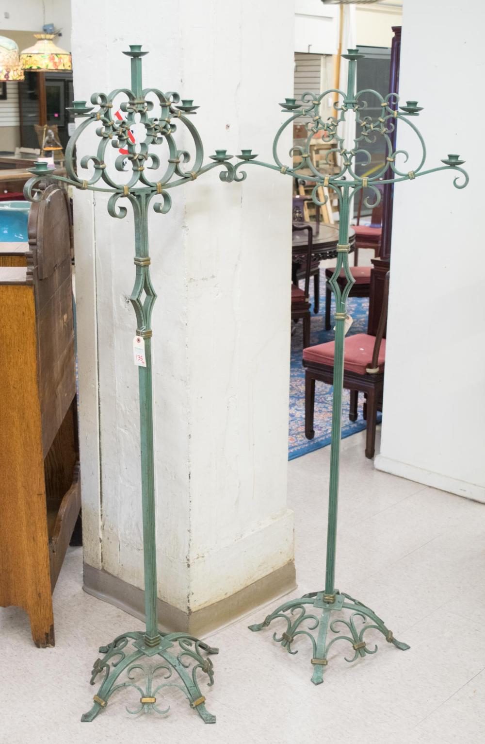 Appraisal: PAIR OF WROUGHT IRON CANDLESTANDS mid- th century with green