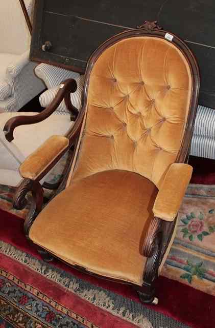 Appraisal: A VICTORIAN MAHOGANY ARMCHAIR with open scroll arms deep button