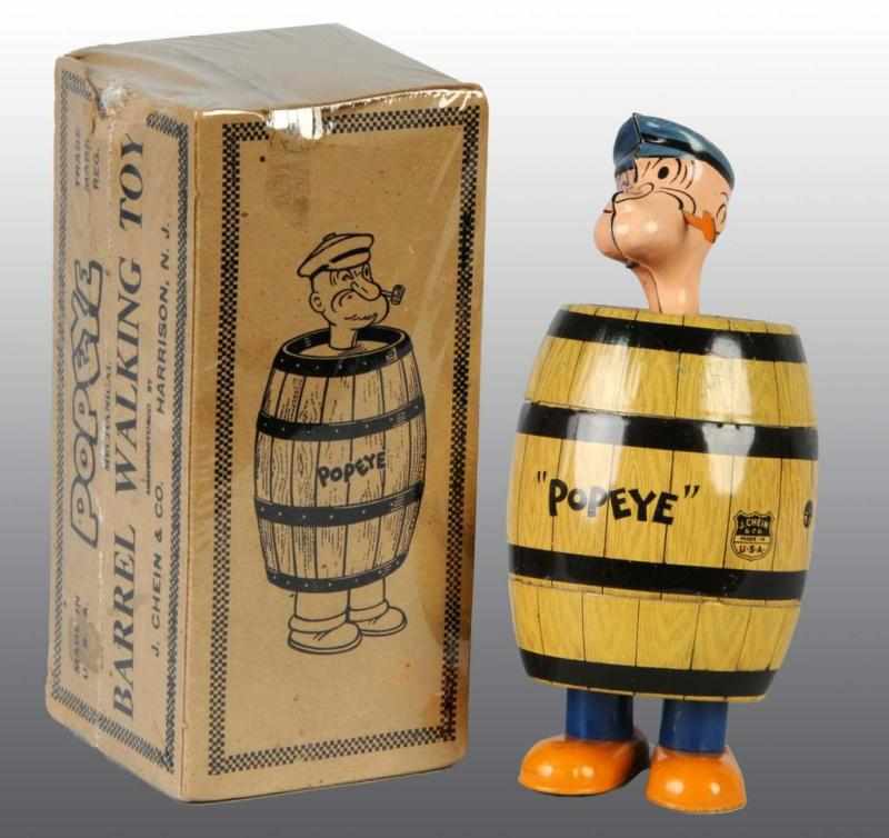 Appraisal: Tin Chein Popeye in Barrel Wind-Up Toy Description American Working