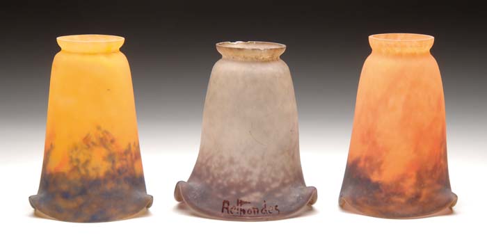 Appraisal: THREE FRENCH ART GLASS SHADES Heavily orange to purple fluted