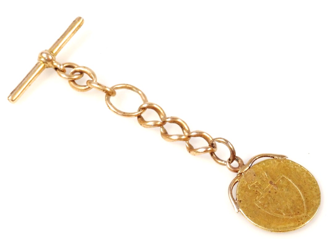 Appraisal: A T-bar part chain yellow metal marked attached to a