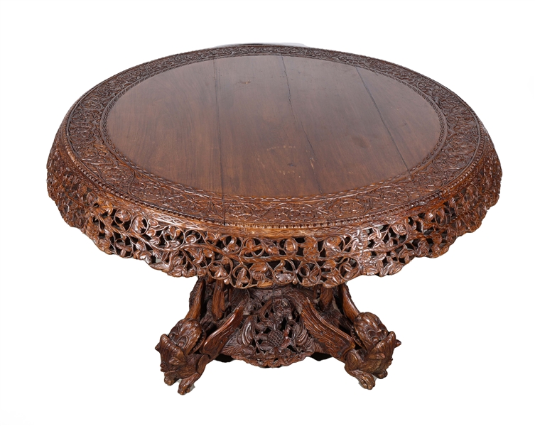 Appraisal: Intricately carved large Indonesian dining table with intricate base depicting