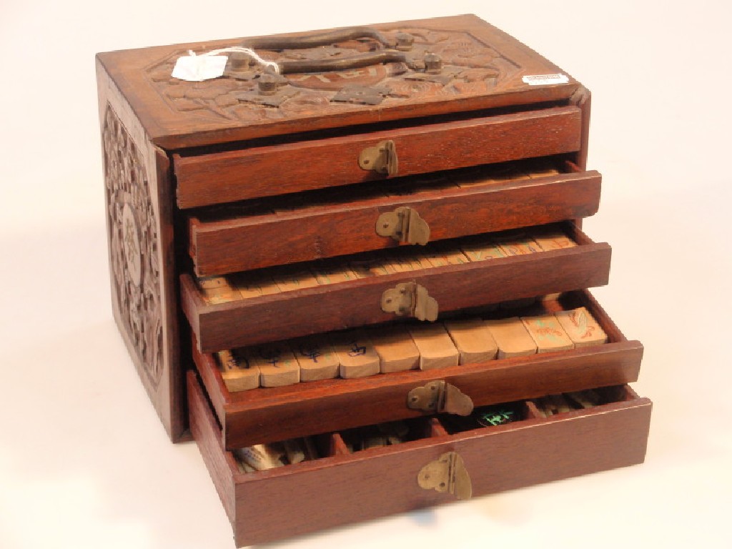 Appraisal: An early thC Mah-Jong set with wooden tiles and ivory