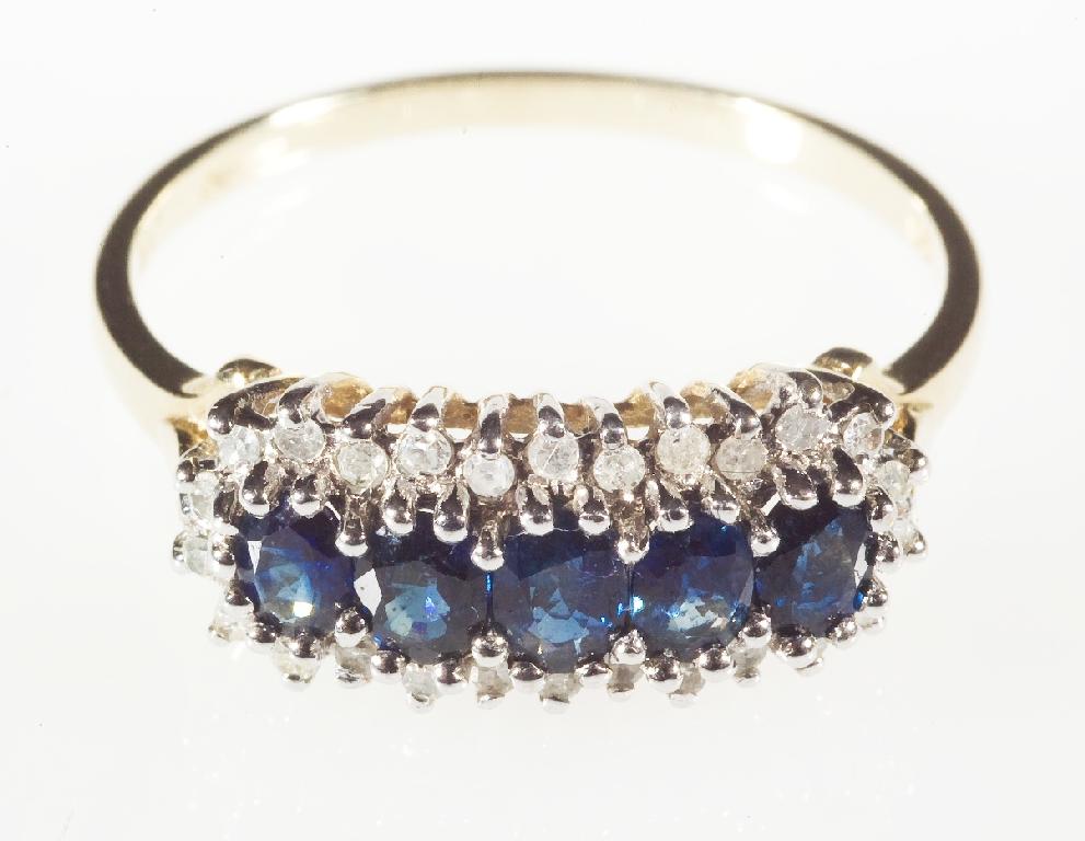 Appraisal: SAPPHIRE AND DIAMOND RING the uniform row of five oval-cut