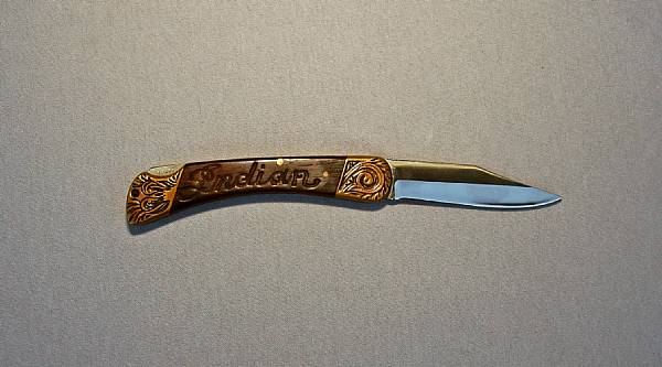 Appraisal: A Von Dutch Hand engraved Indian Scout knife Indian script