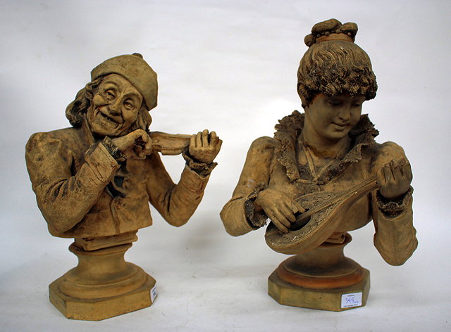 Appraisal: A PAIR OF CONTINENTAL HALF LENGTH PORTRAIT TERRACOTTA BUST depicting