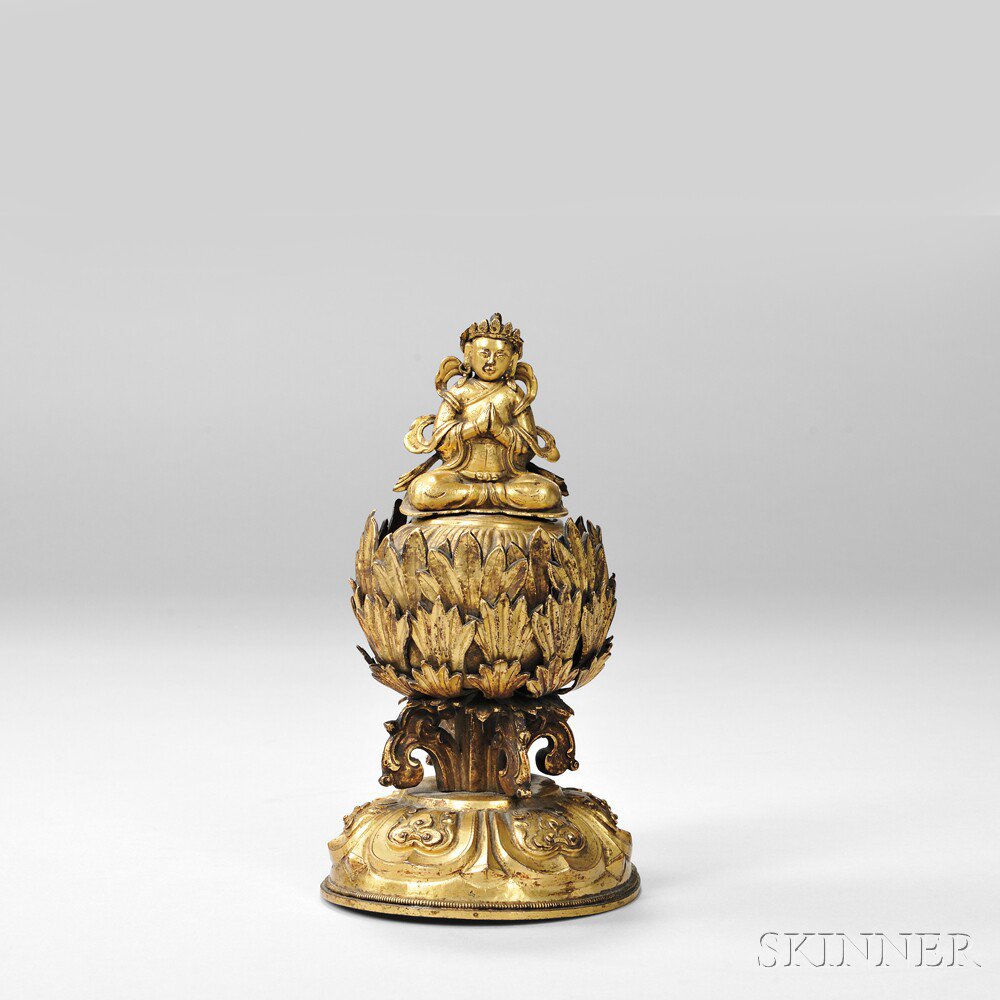 Appraisal: Gilt Repousse Figure of Lama on a Lotus Throne Tibet