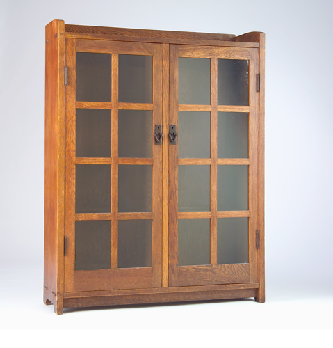 Appraisal: GUSTAV STICKLEY Two-door bookcase no with gallery top eight panes