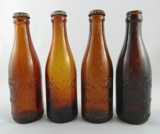 Appraisal: Four Coca Cola Amber bottles Soda- Coca Cola Amber bottles