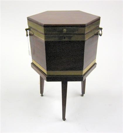 Appraisal: George III style mahogany octagonal cellaret Bound in brass on