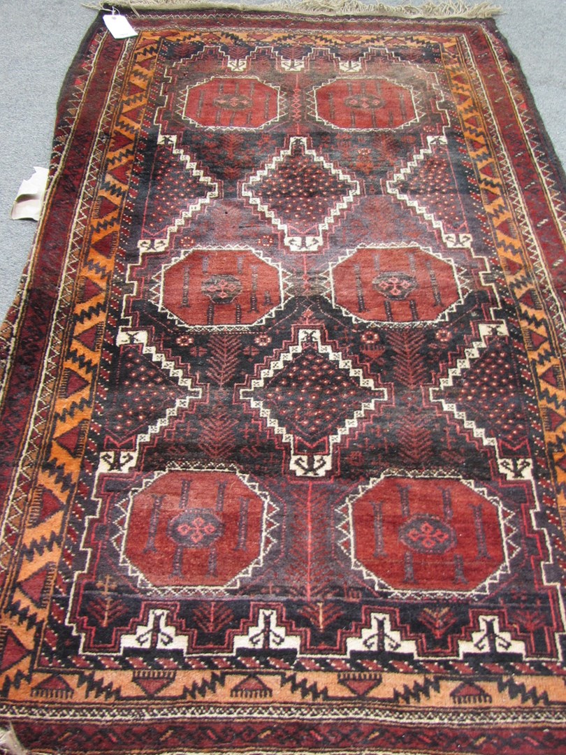 Appraisal: A Beluchistan rug the field filled with interlocking medallions an