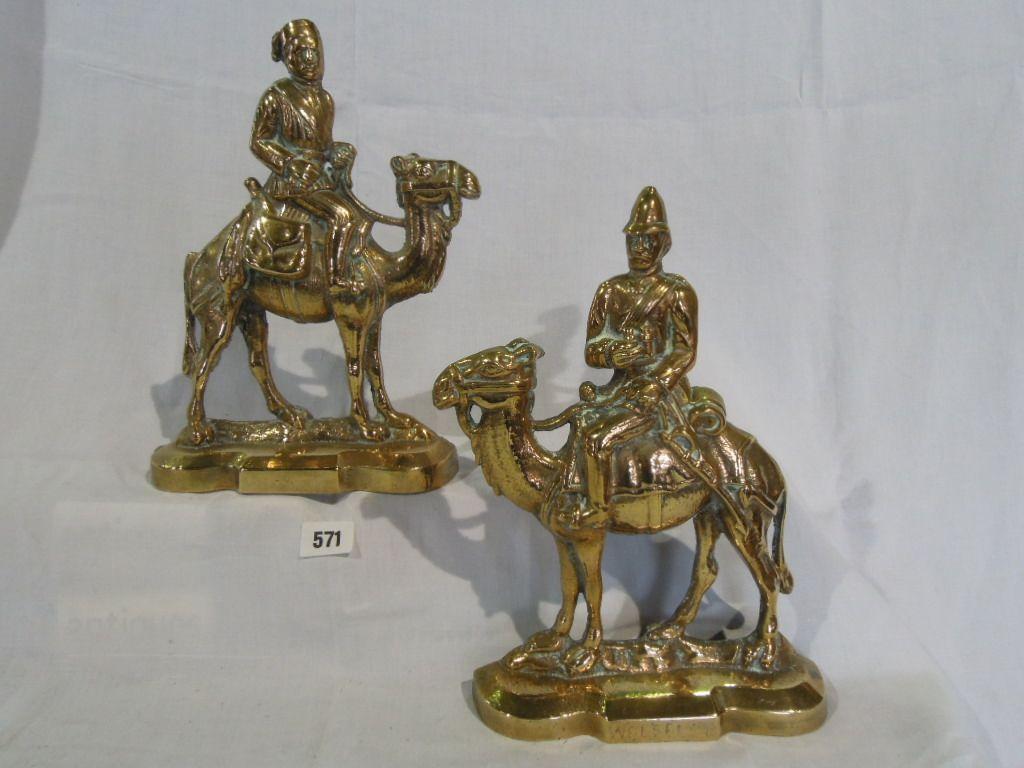 Appraisal: A pair of brass doorsteps in the form of General