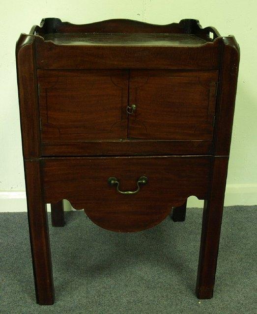 Appraisal: A George III mahogany tray top commode the cupboard doors