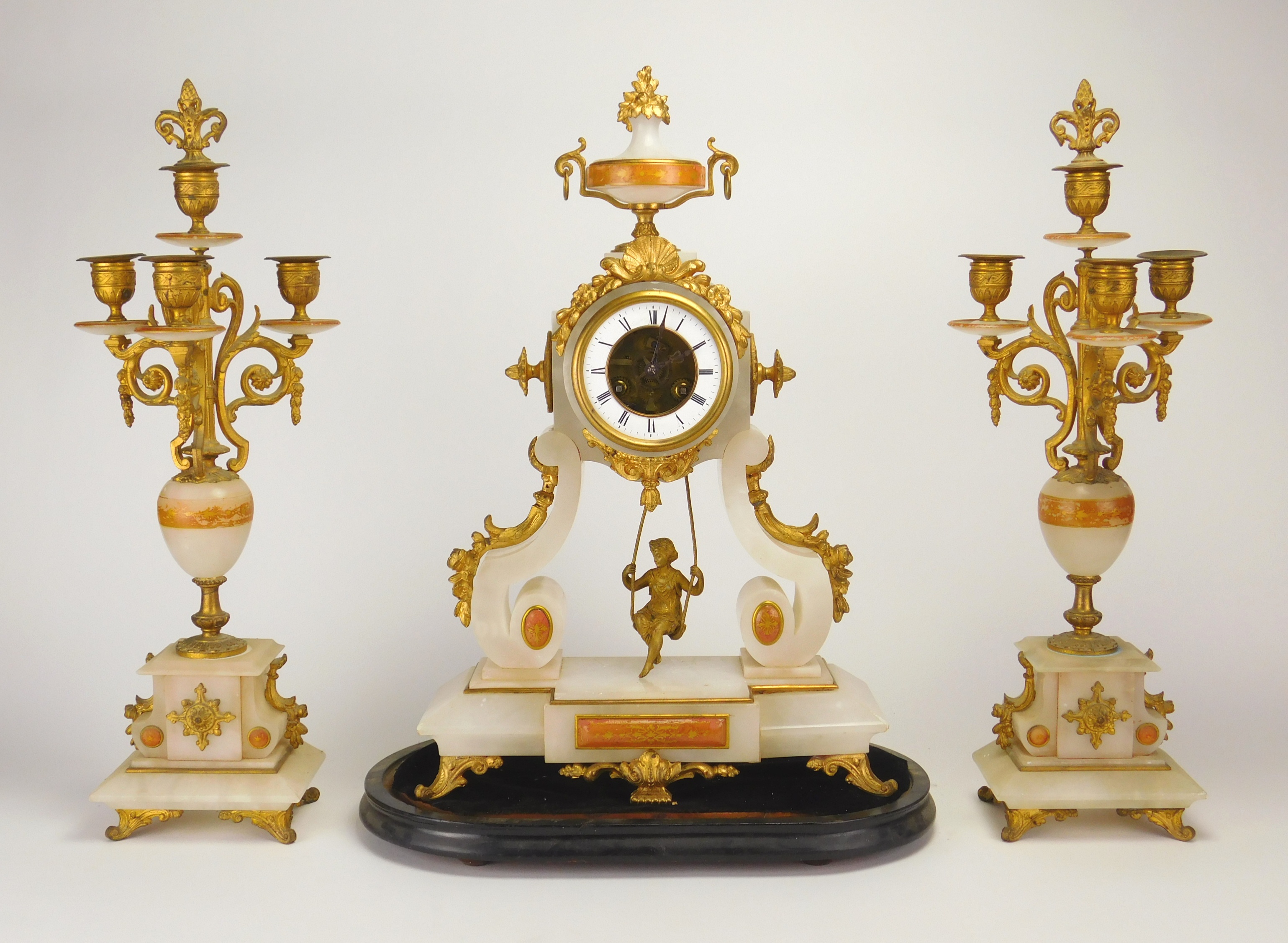 Appraisal: th c French -piece clock set with swinging bisque figure