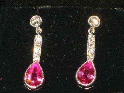 Appraisal: A PAIR OF PINK SAPPHIRE AND DIAMOND EARRINGS comprising pear