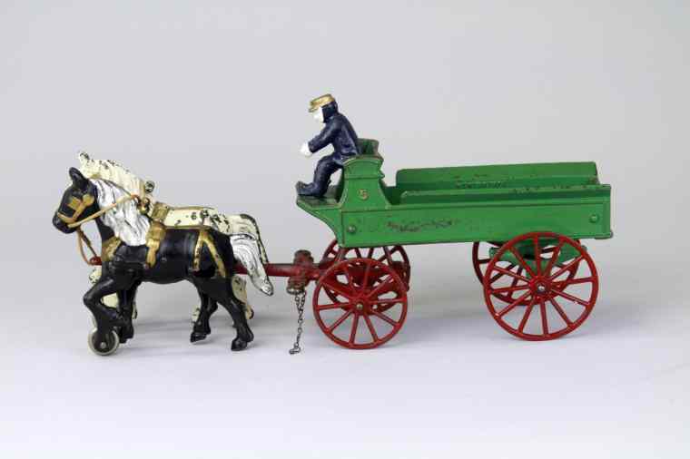 Appraisal: KENTON DRAY WAGON Kenton cast iron painted green wagon with