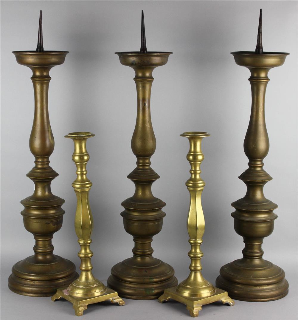 Appraisal: THREE BAROQUE STYLE LARGE PRICKET STICKS th Century with dished