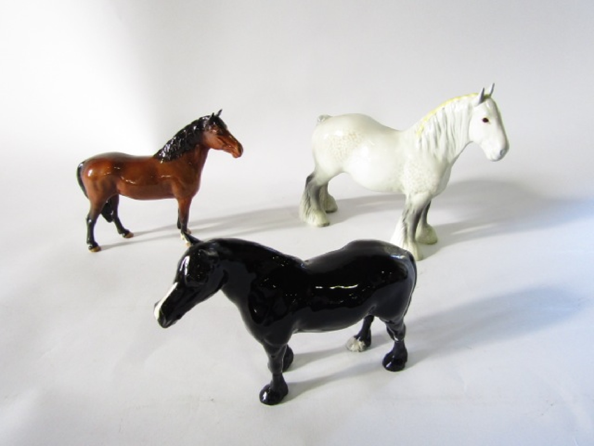 Appraisal: Three Beswick models of horses comprising a grey shire a