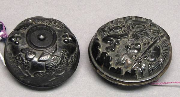 Appraisal: Two carved manju th th Century The first of tortoiseshell