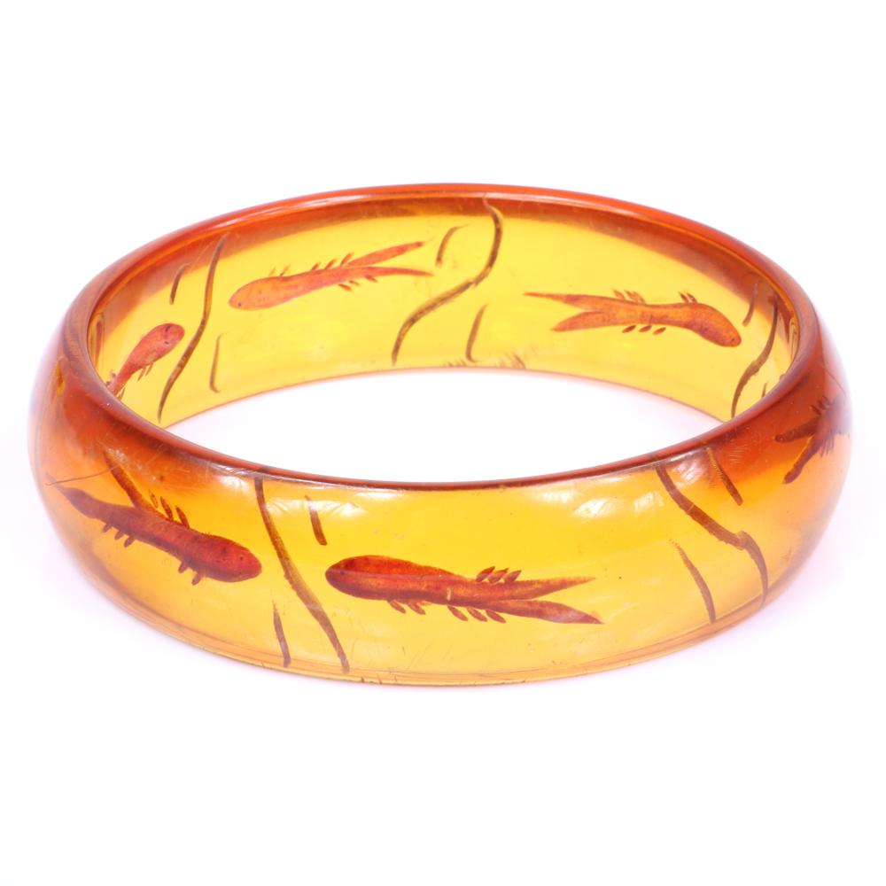 Appraisal: VINTAGE REVERSE CARVED AND PAINTED APPLEJUICE BAKELITE FISHBOWL BANGLE BRACELET