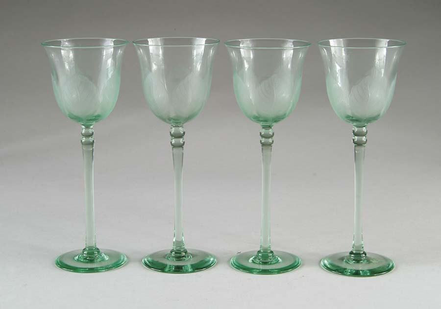 Appraisal: FOUR TIFFANY GLASS STEMS Set of four nicely matched apple-green