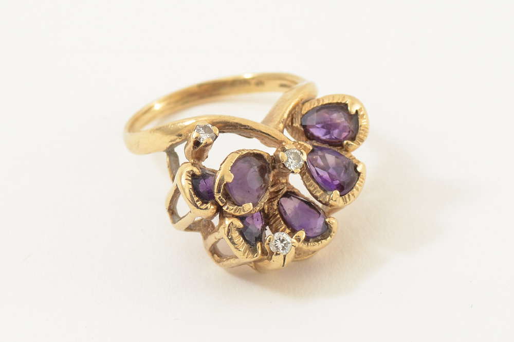 Appraisal: K AMETHYST AND DIAMOND RING natural cut pear cut amethysts