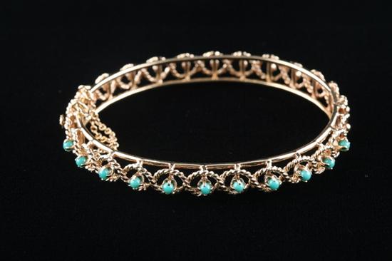 Appraisal: K YELLOW GOLD AND TURQUOISE BANGLE BRACELET Circa s Twisted