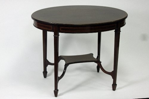 Appraisal: An Edwardian mahogany table with cross banded top and platform